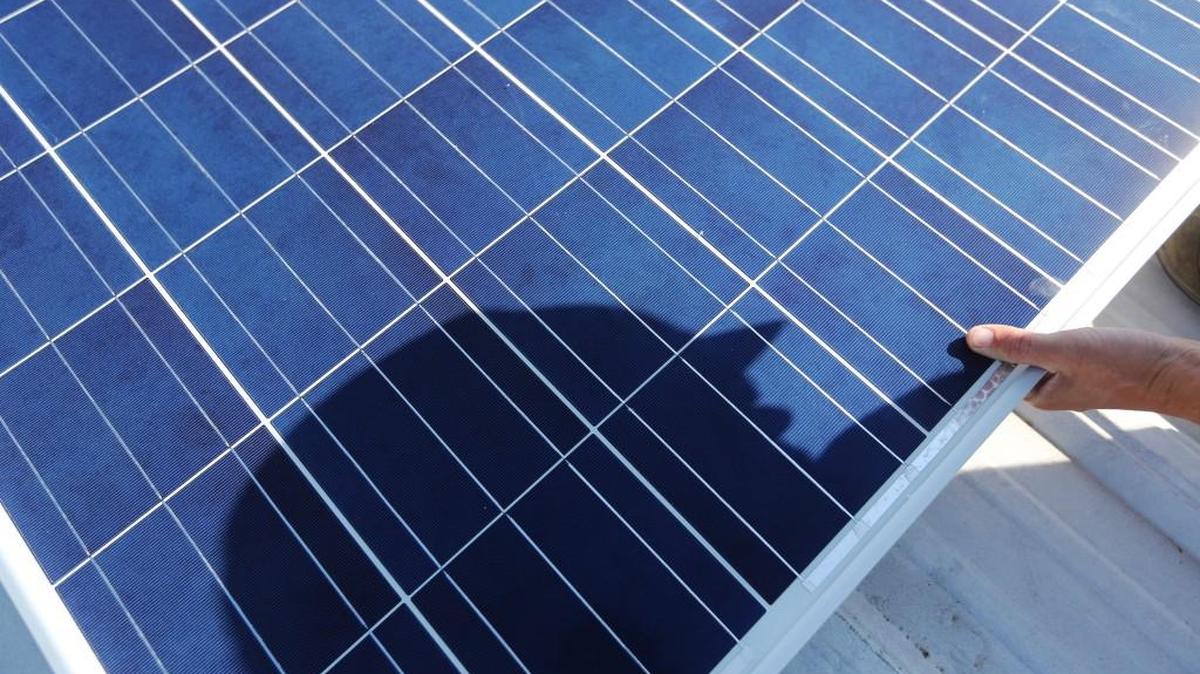 King Solar owner Mark Horst installs solar panels on top of Ark Valley Distributing, the Budweiser distributor for Cowley County. (August 13, 2014)
