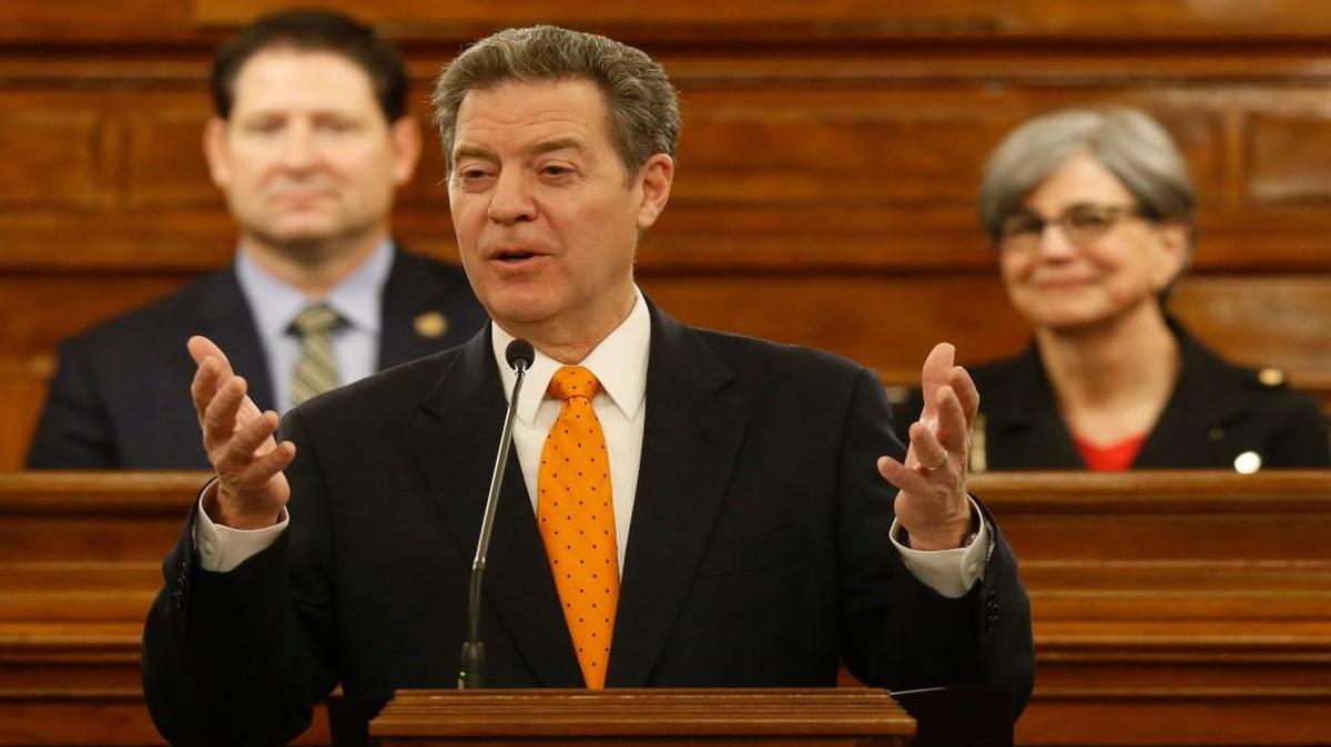 Kansas Gov. Sam Brownback, center, is President Trump’s choice to become ambassador of religious freedom.