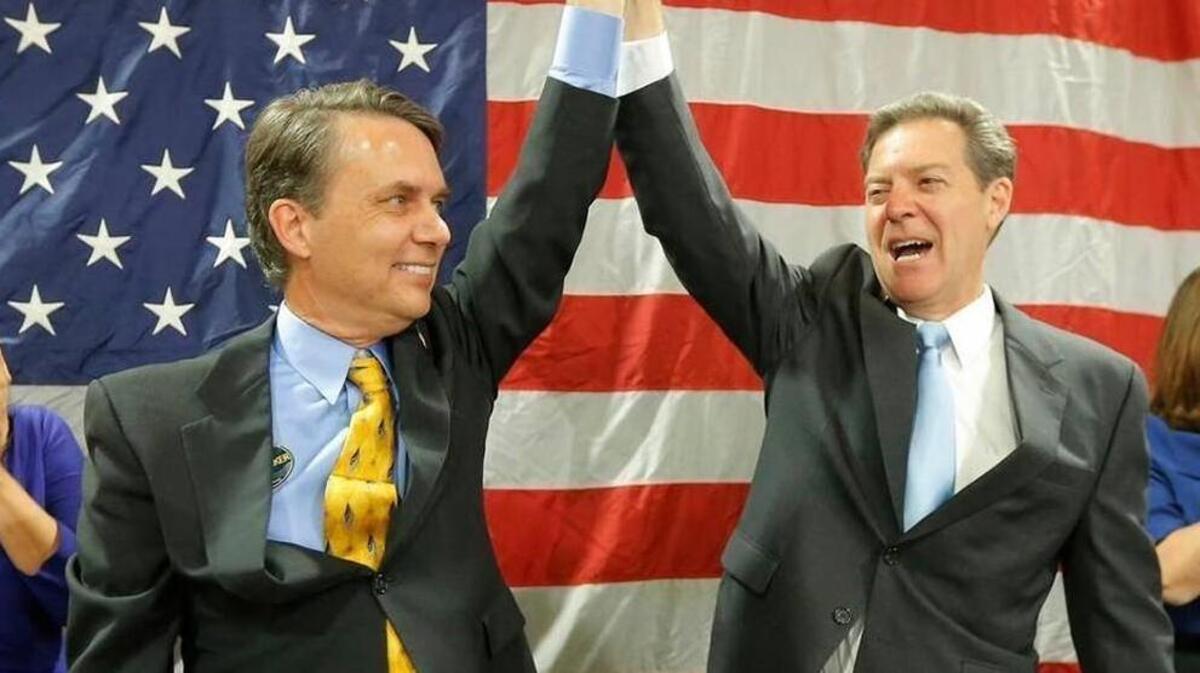 Lt. Gov. Jeff Colyer, left, and Gov. Sam Brownback after they were re-elected in 2014.