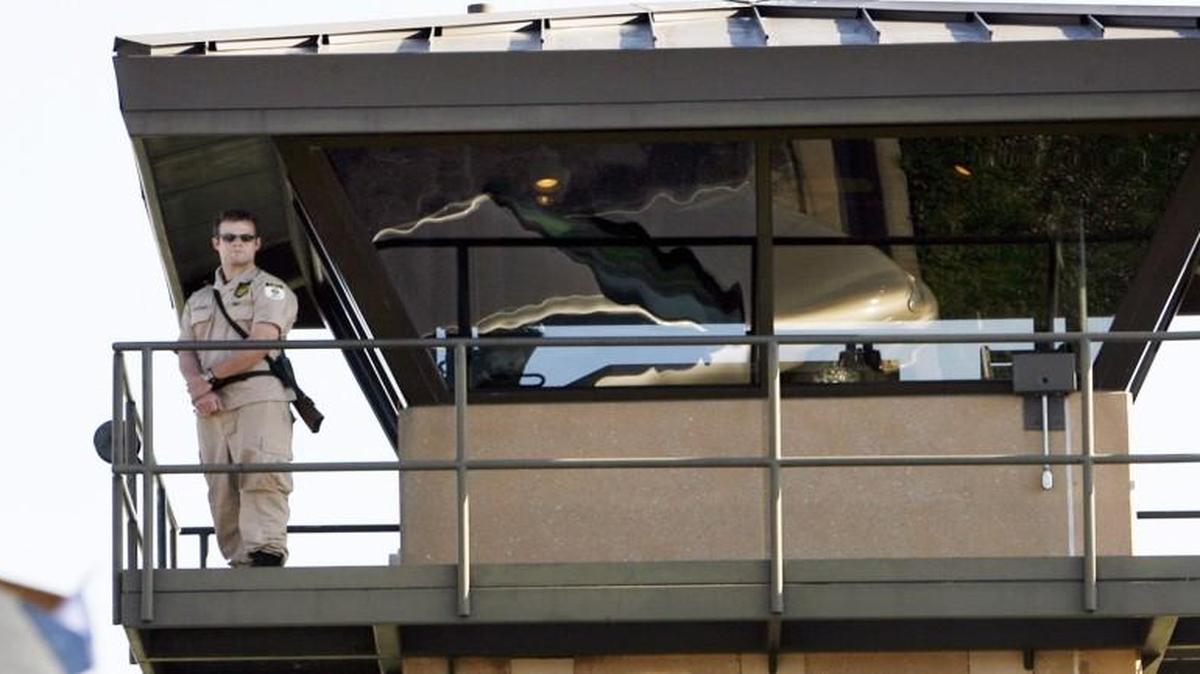 A guard watches from the tower at El Dorado Correctional Facility.