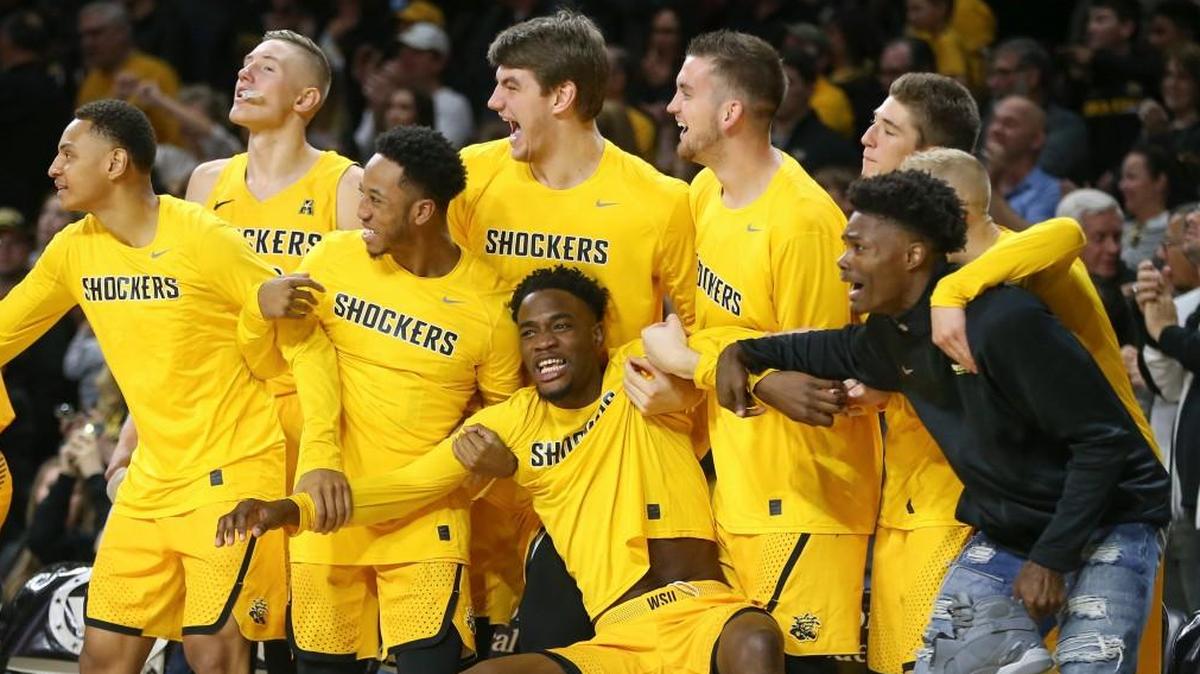 Wichita State players react to a Rashard Kelly dunk earlier this season at Koch Arena. The Shockers play their first American Athletic Conference game Saturday at Connecticut.