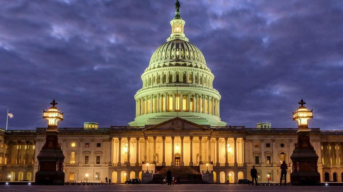 FILE - In this Jan. 21, 2018 file photo, lights shine inside the U.S. Capitol Building as night falls in Washington. Dozens of web addresses implying U.S. senators were âfor saleâ have been quietly and mysteriously purchased online, amid heightened concerns on Capitol Hill that foreign agents _ especially Russians _ might be trying to interfere in the upcoming midterm elections. The Associated Press has determined that Democrats were responsible. The cybersecurity director for the sergeant-at-arms in the Senate has begun to look into the matter. (AP Photo/J. David Ake)
