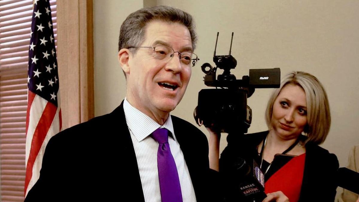 Gov. Sam Brownback reacts Wednesday to the news that his nomination to become ambassador-at-large for international religious freedom advanced Wednesday on a tied procedural vote broken by Vice President Mike Pence. Brownback later was confirmed with the same 50-49 margin.