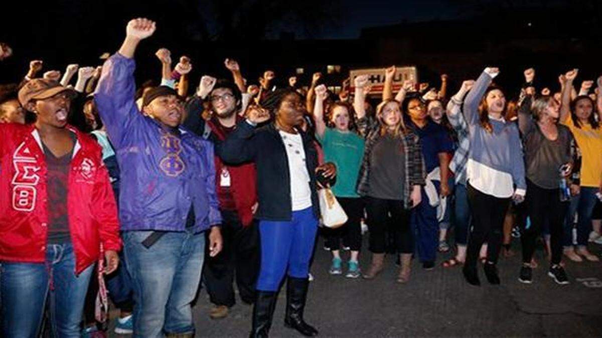 
University of Oklahoma students rally outside the now-closed Sigma Alpha Epsilon fraternity house.
