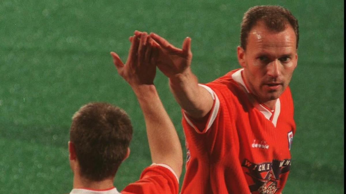 Wings star Erik Rasmussen, right, is congratulated by teammate Sterling Wescott following a 1999 goal at the Kansas Coliseum.