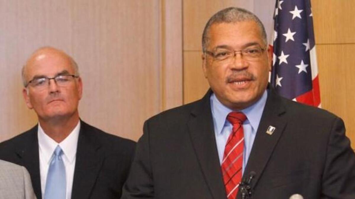Former Wichita mayor Carl Brewer, right, and House Minority Leader Jim Ward, center, in 2012.