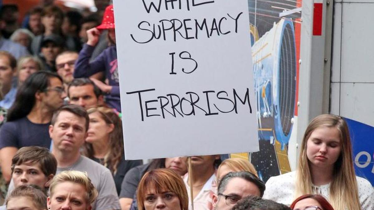 People attend a rally Aug. 14 in Salt Lake City. Utah residents are holding unity and anti-racism rallies to denounce the messages of hate and violence of white supremacists at a weekend rally in Charlottesville, Va.