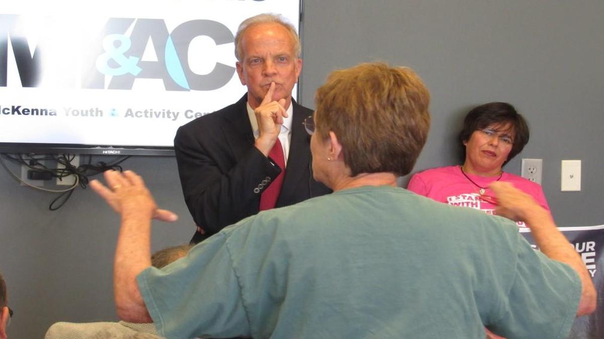 Jerry Moran listens to a speaker at the town hall meeting in Palco on June 6.
