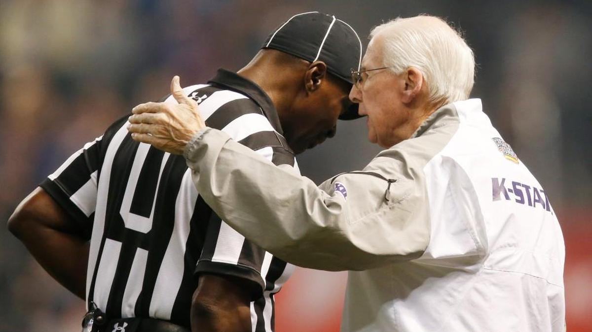 K-State coach Bill Snyder has a moment with an official last week during the Cactus Bowl.
