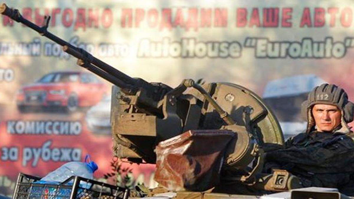 
A soldier of the Ukrainian army sits on a tank in the port city of Mariupol, southeastern Ukraine.
