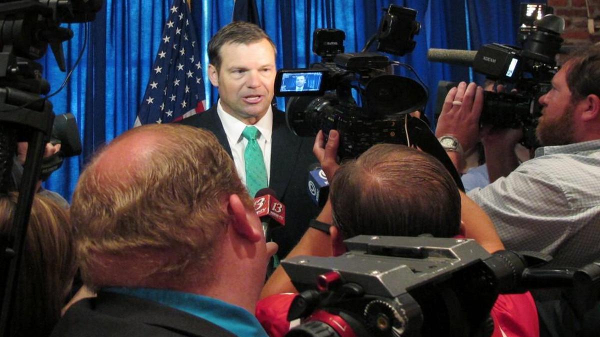 Kansas Secretary of State Kris Kobach answers questions from reporters following the launch of his campaign for governor June 8 in Lenexa. Kobach is vice chairman of President Donald Trump's commission on election fraud and has advised Trump on immigration and voter fraud issues.