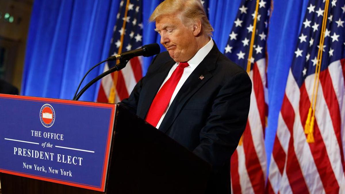 President-elect Donald Trump pauses during a news conference in the lobby of Trump Tower.