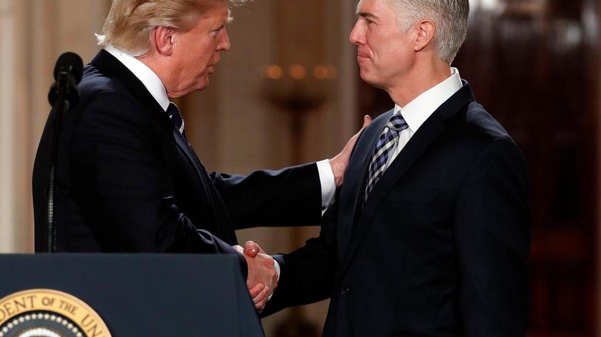 President Trump shakes hands with Neil Gorsuch, his choice for the U.S. Supreme Court.