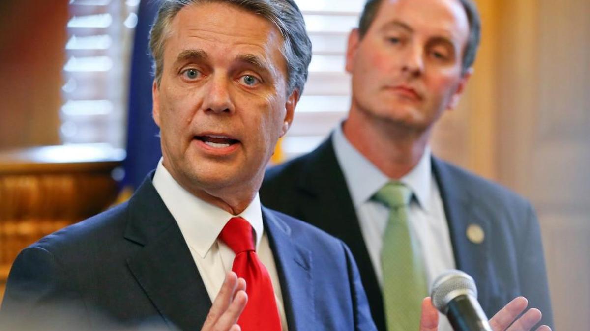 Gov. Jeff Colyer, left, conceded the Republican nomination for governor to Secretary of State Kris Kobach on Tuesday evening.