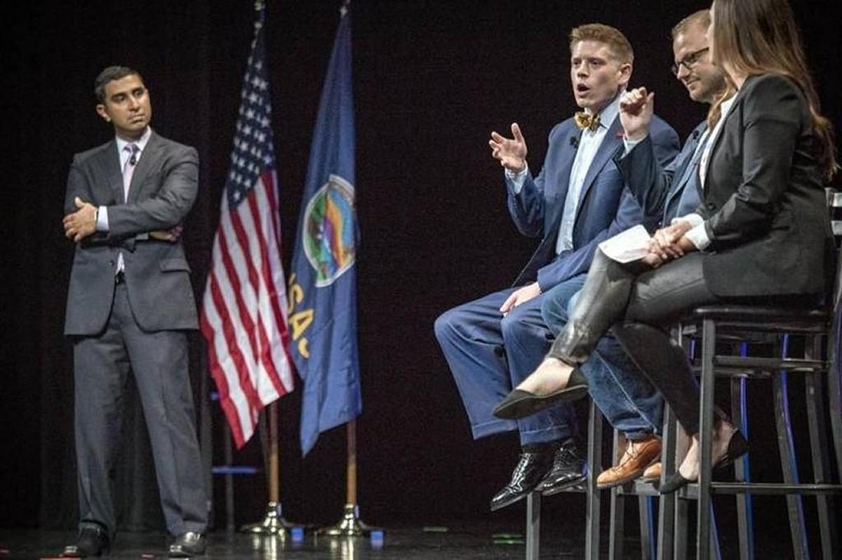 From left, Faiz Shakir, national political director of the ACLU, listens to a panel discussion in Lawrence including Micah Kubic, executive director of ACLU Kansas, and Bobby Hoffman and Molly McGrath, both with the ACLU.