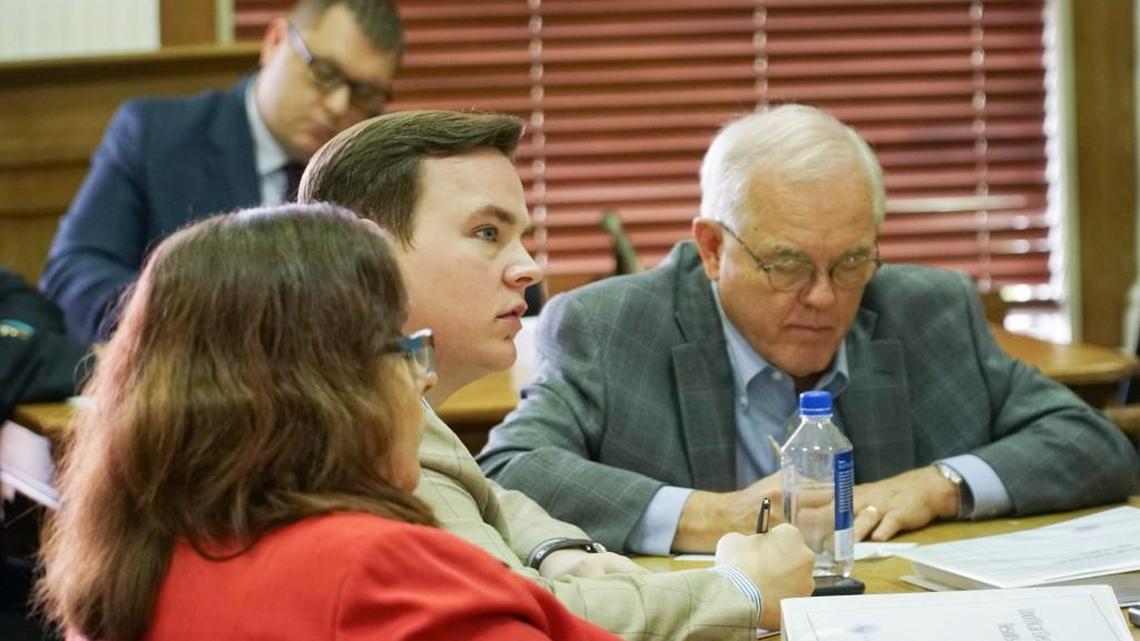 Sedgwick County Commissioner Michael O’Donnell listens as Election Commissioner Tabitha Lehman speaks to Sedgwick County officials working as the county election board. The board directed Lehman to count more than 1,300 provisional and otherwise disputed ballots from the Aug. 7 primary. (Aug. 13, 2018)