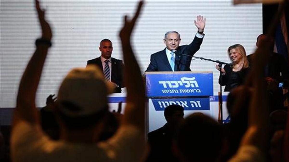 
Israeli Prime Minister Benjamin Netanyahu greets supporters after his Likud party won 30 seats in the parliament.
