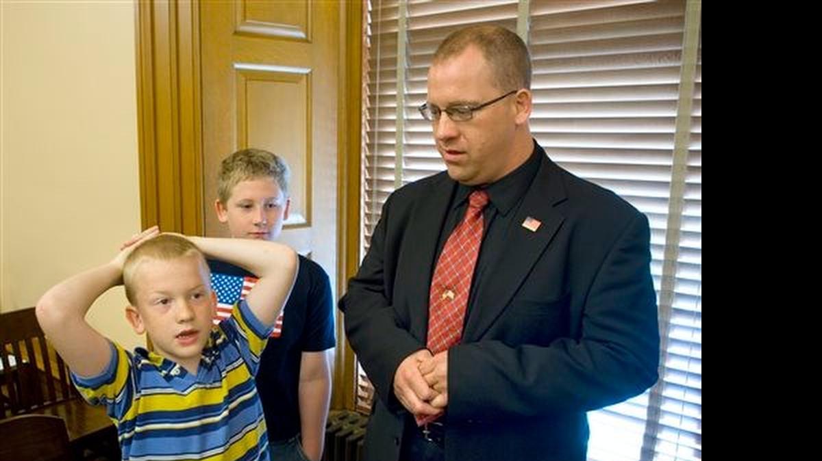 
Nathan, left, and Coleson Reinecker with their father, Nick Reinecker
