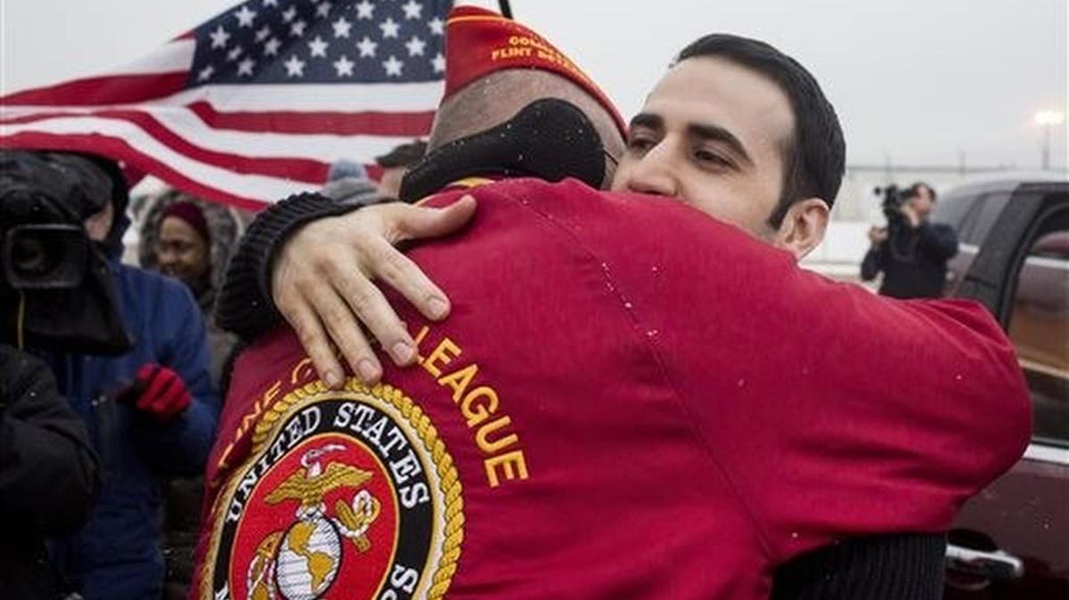 U.S. Marine Amir Hekmati is greeted after returning to his hometown of Flint, Mich. He was imprisoned in Iran for more than four years.