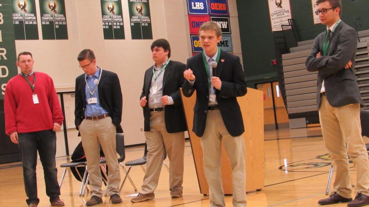 Tyler Duzich, second from right, makes a point during a candidate forum at Free State High School in Lawrence last month.