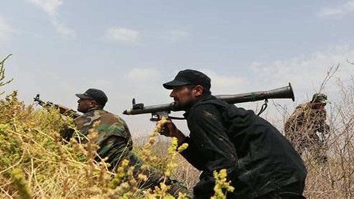 
Iraq Shiite fighters prepare to fight militants from the extremist Islamic State about 40 miles south of Baghdad.
