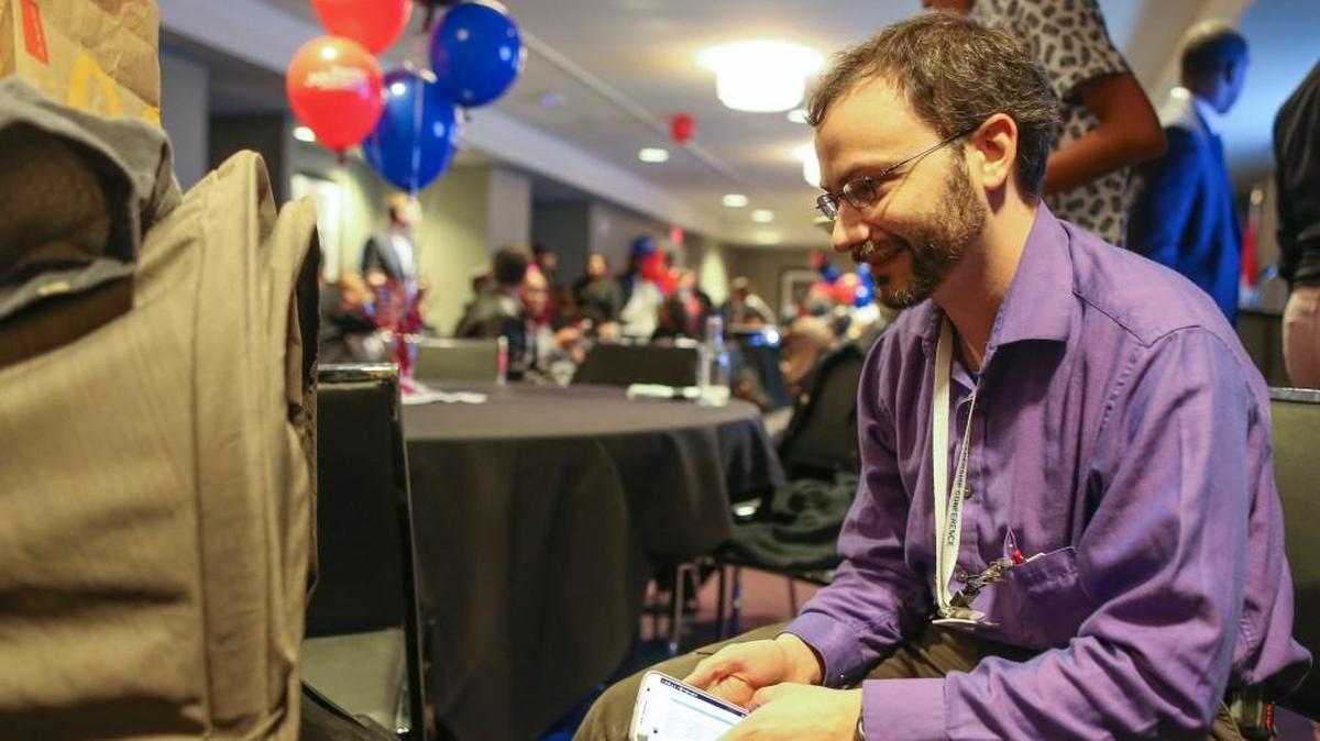 Ben Blankley, candidate for Wichita school board, attends to his child while attending an election watch party at the Ambassador Hotel on Nov. 7. Blankley defeated incumbent Betty Arnold by 84 votes after a final canvass was held Monday.