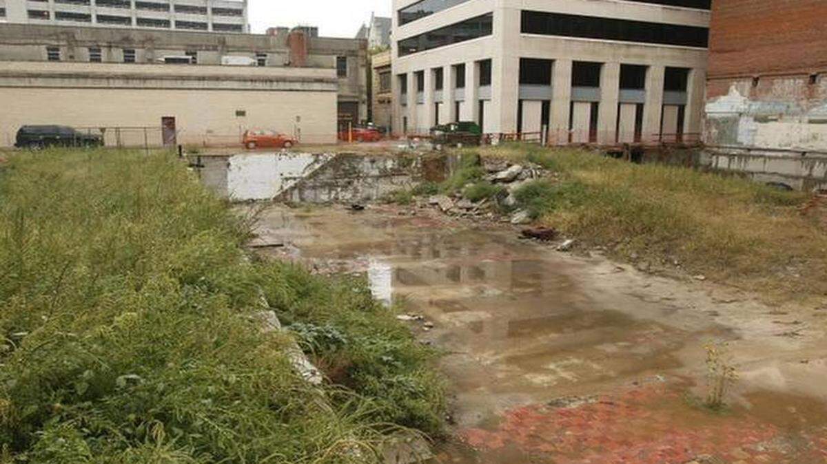 
Covering the pit with a temporary park may remove an eyesore, but it is no substitute for the construction of new residential and commercial structures that would return true vitality to the area.
