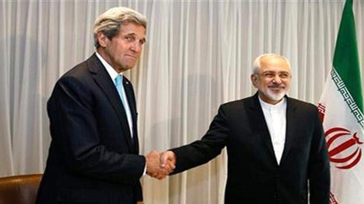 
U.S. Secretary of State John Kerry shakes hands with Iranian Foreign Minister Mohammed Javad Zarif before a meeting in Switzerland last week. 
