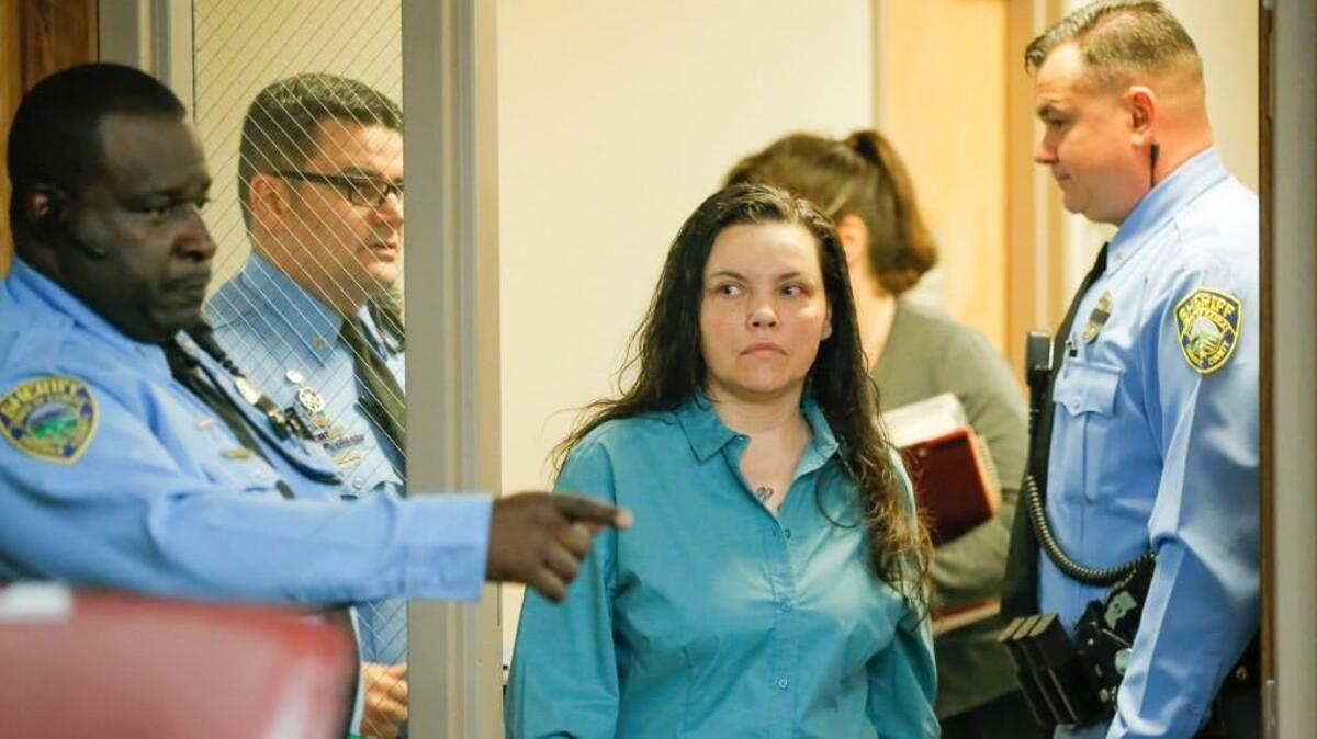 
Kisha Schaberg enters a Sedgwick County courtroom on May 15, 2015 to plea no contest to capital murder charges in the 2013 shooting deaths Roger and Melissa Bluml. 
