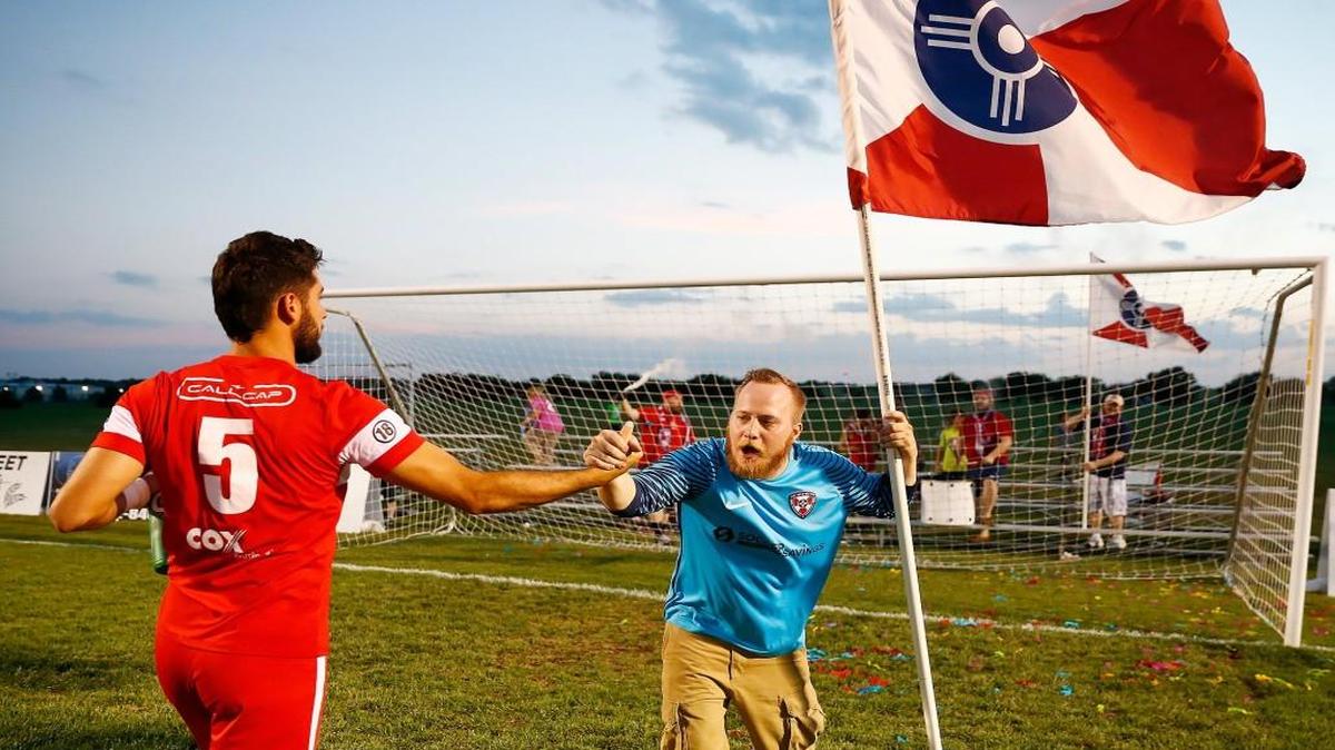 FC Wichita fan Chris Baldwin congratulates Leo Sosa following a playoff game last summer at Stryker.