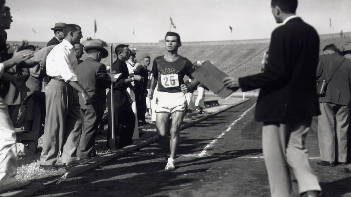 Allen Frame earned All-American honors at Kansas in cross country in 1954 and 1955 and in track in 1955.