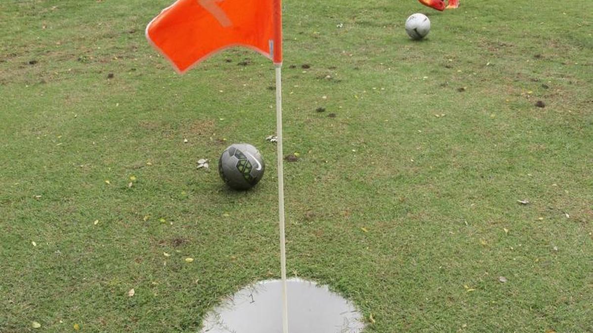 
Dillon Kerans putts his ball toward the first hole while playing footgolf at Clapp Park. He is part of a local footgolf group who plan on traveling to Chicago for a footgolf tournament. 
