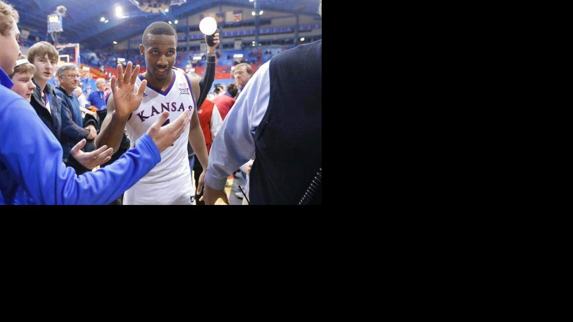 
Kansas guard Wayne Selden Jr. celebrates with fans after the Jayhawks beat Iowa State Monday night at Allen Fieldhouse. Kansas won 89-76 to take control of the Big 12 race. 

