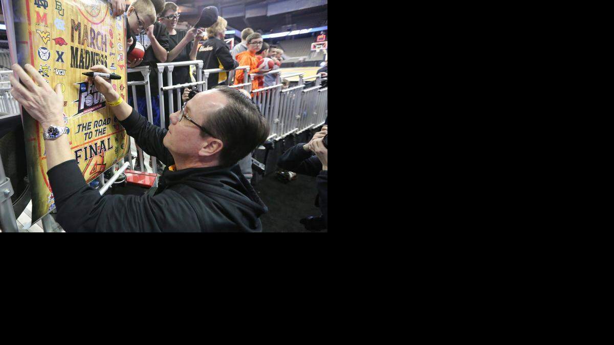 
Wichita State coach Gregg Marshall signs autographs for fans after the Shockers practice at the CenturyLink Center in Omaha on Thursday. Wichita State will face Indiana on Friday.
