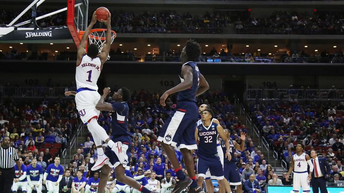 Kansas guard Wayne Selden Jr. (1) slams in a huge dunk in the 2nd half as Kansas took on Connecticut in the 2nd round of the NCAA tournament in Des Moines Saturday night. Selden lead Kansas scoring with 22 points(March 19, 2016)