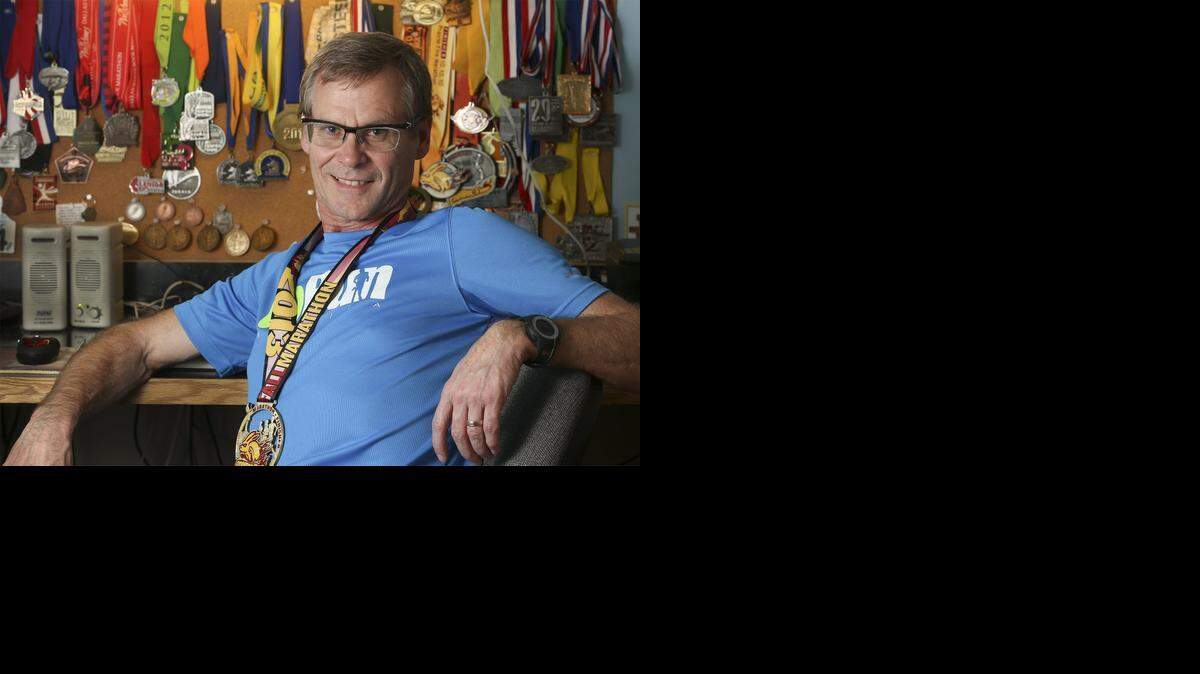 
Marathon runner Winston Kenton has a wall full of medals from past races in his Wichita home. “Whenever I look up, I see all those memories. To me, they’ll always mean something special,” he said.
