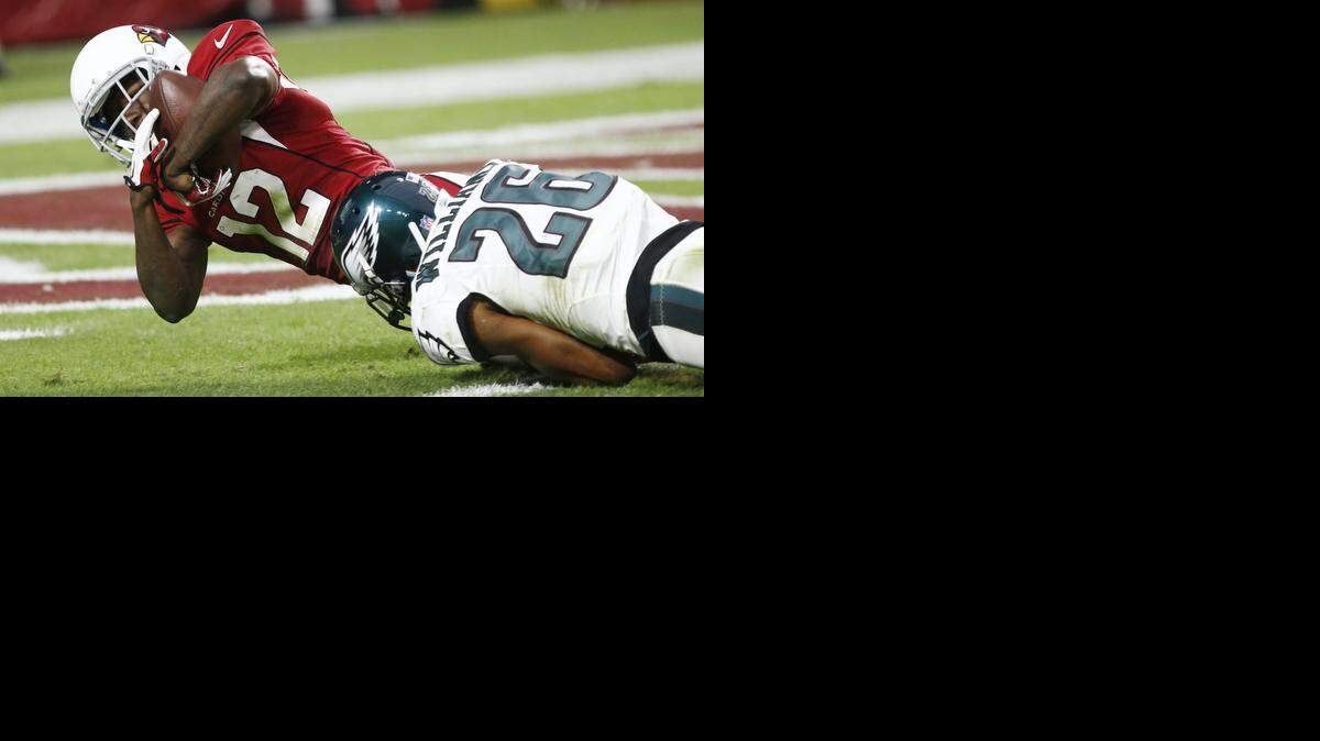 
Cardinals wide receiver John Brown, from Pittsburg State, scores a go-ahead with touchdown with 1:21 to play Sunday. Tackling him in the end zone is the Eagles’ Cary Williams, who played at Washburn.
