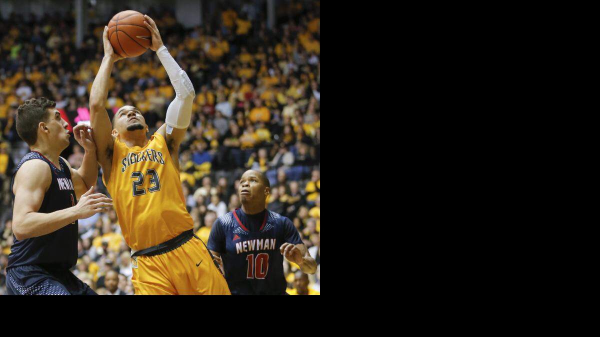 
Wichita State's Fred VanVleet goes to the basket against Newman University's Luka Vermezovic during the second half of their game at Koch Arena on Sunday. 
