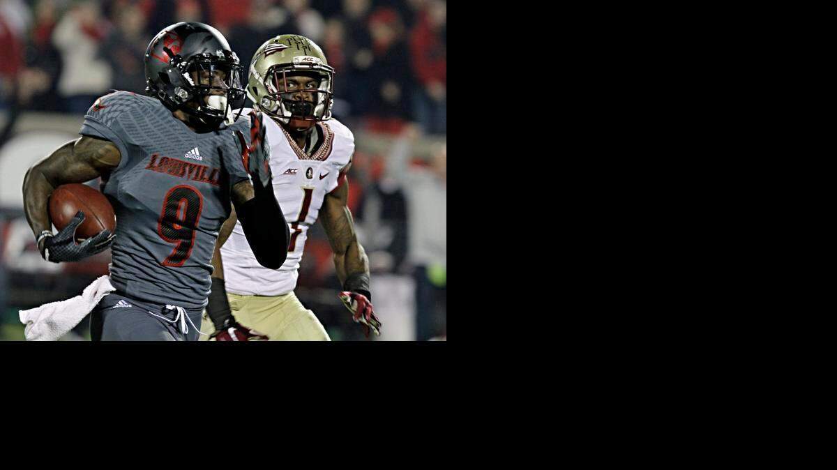 
Louisville wide receiver DeVante Parker (9) outran Florida State defensive back Tyler Hunter (1) on a long pass on Oct. 30, 2014. 
