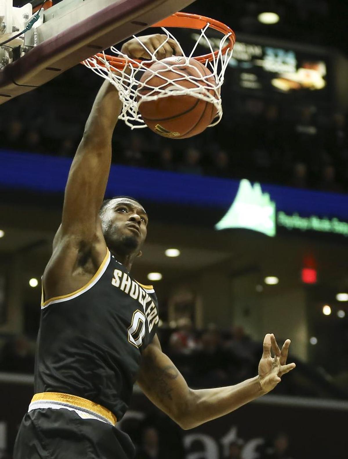 Wichita State forward Rashard Kelly dunks over Missouri State guard Ryan Kreklow during the first half of their game at JQH Arena in Springfield, Mo., Wednesday night.