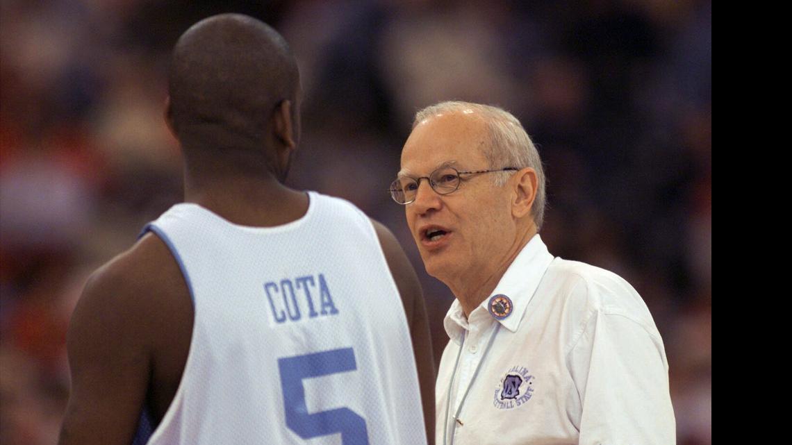 
North Carolina senior Ed Cota and coach Bill Guthridge talk during practice before the 2000 national semifinals.
