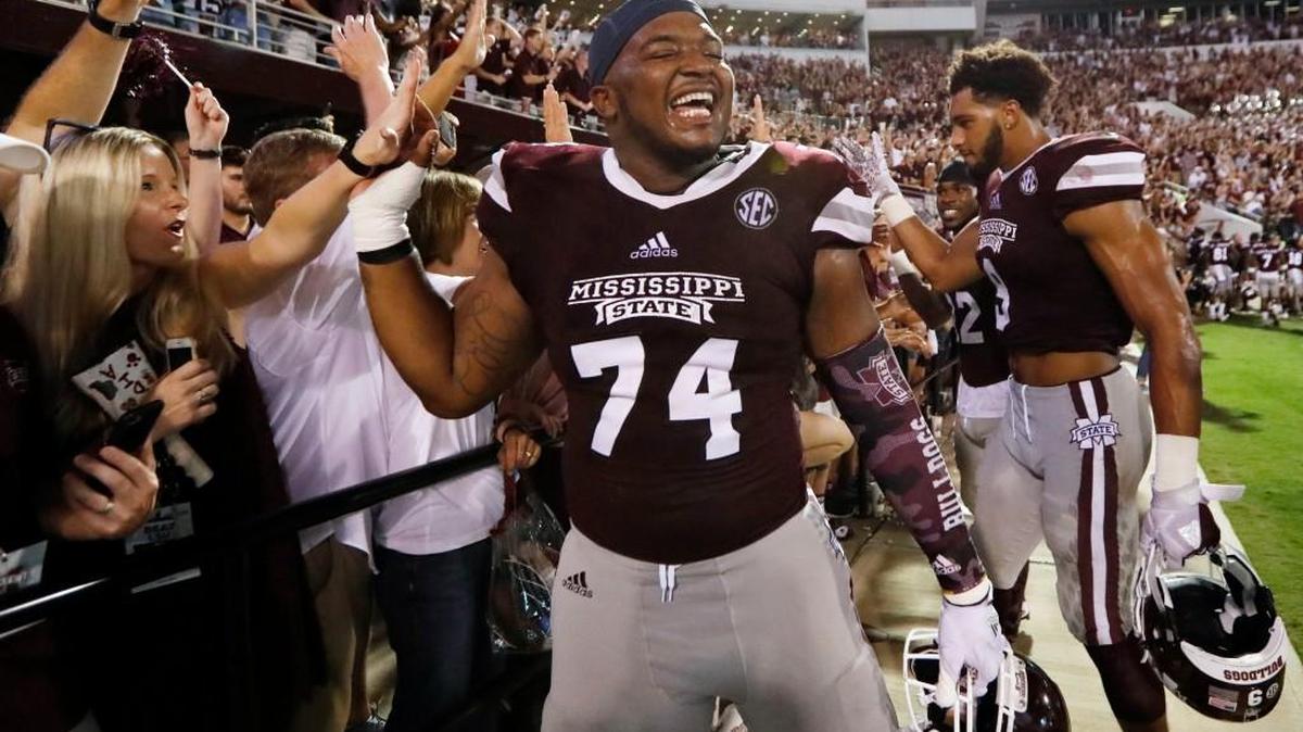 Mississippi State offensive lineman Elgton Jenkins is congratulated by fans following their NCAA college football game win against LSU in Starkville, Miss., Saturday, Sept. 16, 2017. Mississippi State won 37-7. (AP Photo/Rogelio V. Solis)