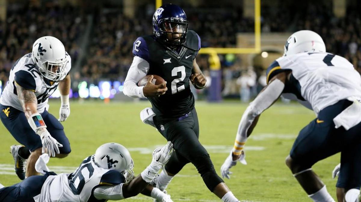 TCU quarterback Trevone Boykin runs for a touchdown against West Virginia. (AP Photo/Tony Gutierrez)
