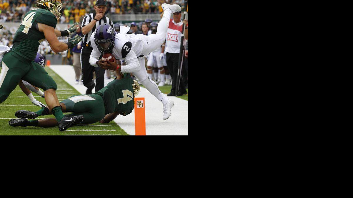 
TCU quarterback Trevone Boykin (2) is forced out of bounds short of the goal line by Baylor cornerback Xavien Howard (4) during the first quarter in Waco on Oct. 11.
