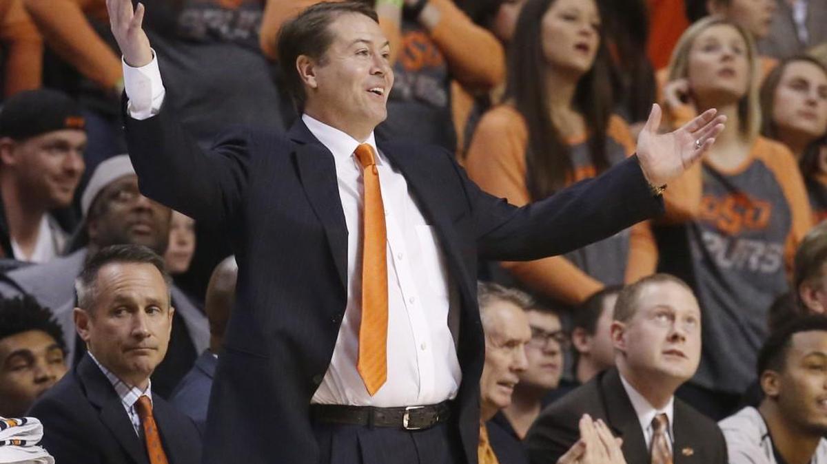 Oklahoma State head coach Travis Ford gestures during a game against Kansas. (AP Photo/Sue Ogrocki)