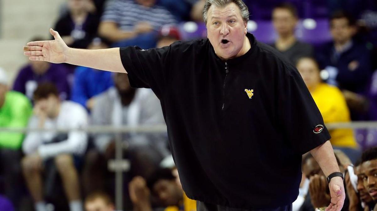 West Virginia coach Bob Huggins shouts instructions to his players during the second half of an NCAA college basketball game against TCU, Monday, January 4, 2016, in Fort Worth, Texas. West Virginia won 95-87. (AP Photo/Brandon Wade)