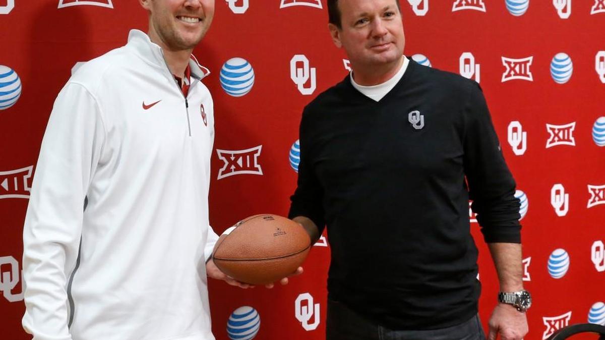 Retired Oklahoma coach Bob Stoops, right, poses for a photo with new coach Lincoln Riley earlier this summer. “The Big 12 is poorer for not having Bob Stoops any longer as a head coach in our league,” Big 12 commissioner Bob Bowlsby said Monday.