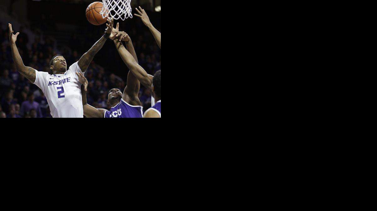 
Kansas State guard Marcus Foster (2) rebounds against TCU forward Devonta Abron, right, during the first half of an NCAA college basketball game in Manhattan, Kan., Wednesday, Jan. 7, 2015. (AP Photo/Orlin Wagner)
