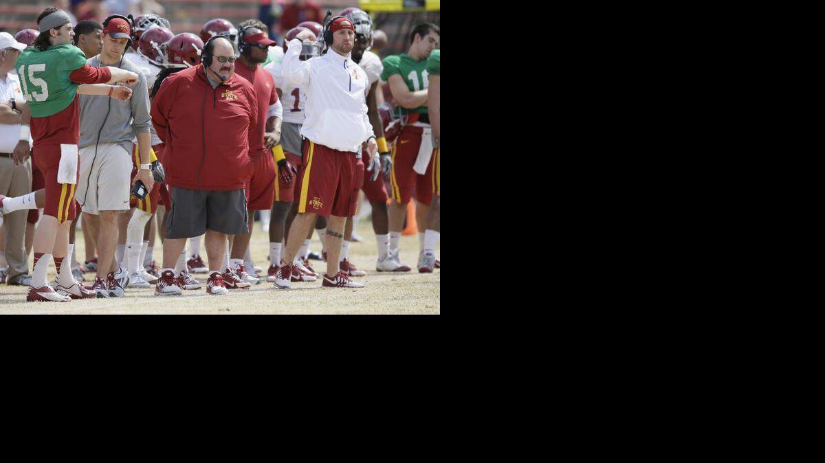 
Iowa State offensive coordinator Mark Mangino, center, looks on during Iowa State's annual spring football game in April.
