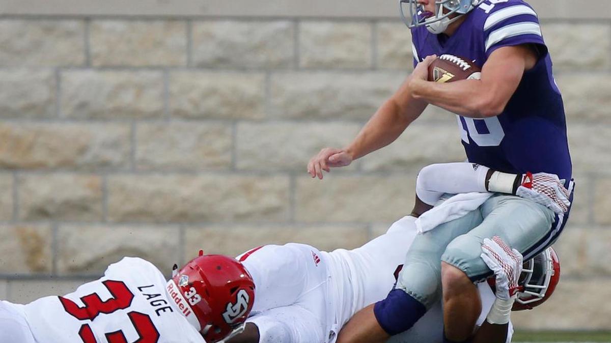 K-State quarterback Jesse Ertz (16) is tackled after his first snap Saturday against South Dakota in Manhattan.